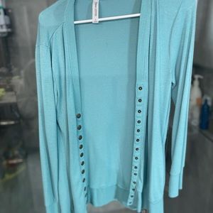 Sweater with button snaps
